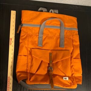 Like New ORI Orange Backpack, zip/roll top, laptop sleeve. See pics measurements